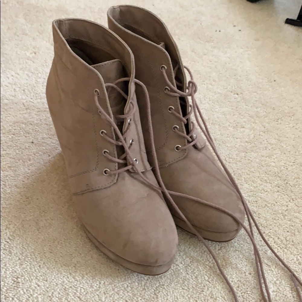 Taupe wedged booties.